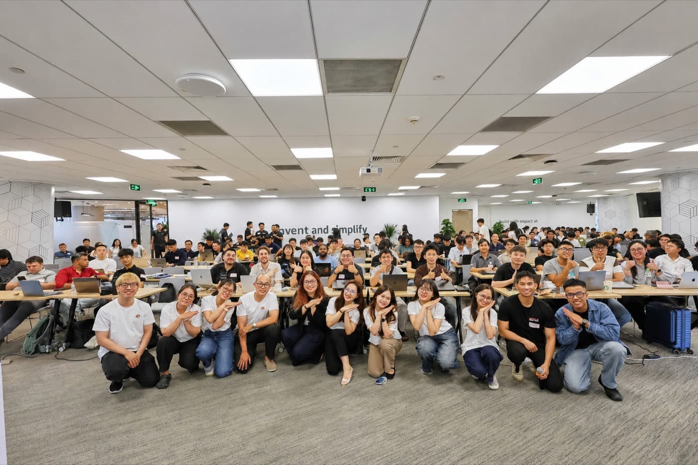 A full lecture hall of students at a TinyFish event